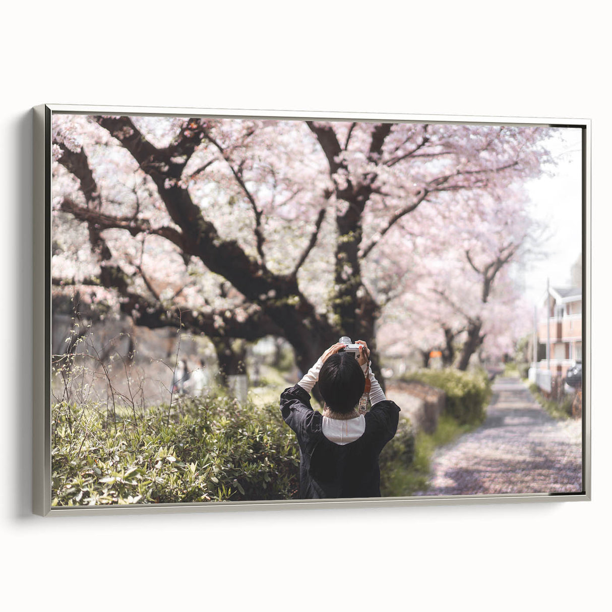 Framed canvas of a vintage-style Japanese landscape painting with colorful art on a black background.