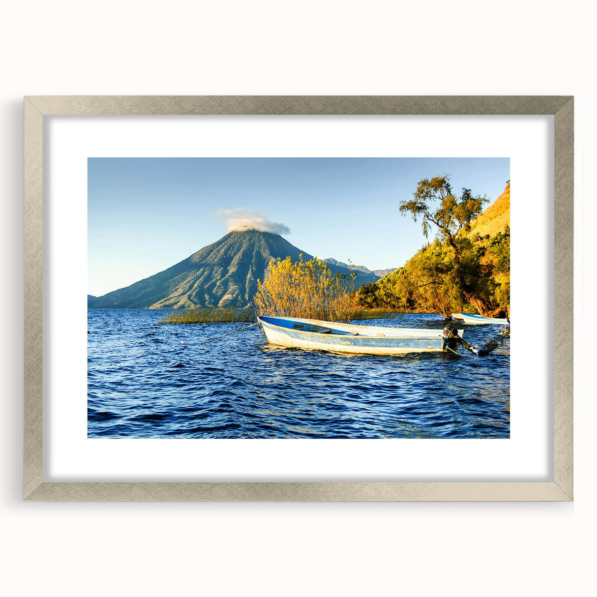 Textured abstract art print depicting a Central American scenery in muted earth tones, framed in silver.