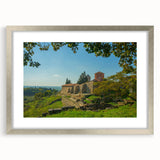 Textured abstract art print of a European scenery in muted earth tones on a framed silver mat, suitable for bedroom art.