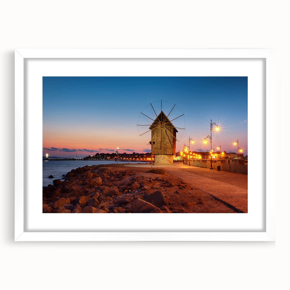 Abstract art print of a European scenery in muted earth tones on a white framed canvas, suitable for dining room decor.