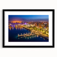 Extra large abstract art print of a colorful European scenery on a textured canvas, framed in black.