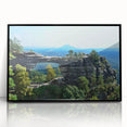 Large abstract wall art depicting a European scenery in black acrylic frame, ideal for modern living room decor.