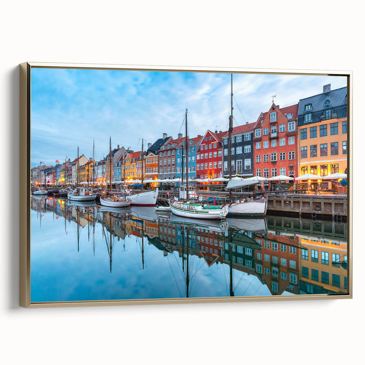 Framed canvas depicting a vintage poster-style landscape of Denmark, in muted gold and black tones.
