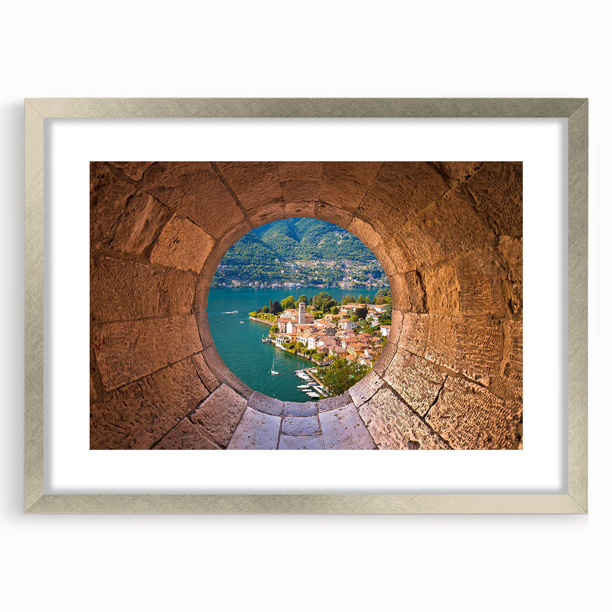 Extra large wall art depicting an abstract view of Lake Como in muted blue and silver tones, framed with a silver mat.