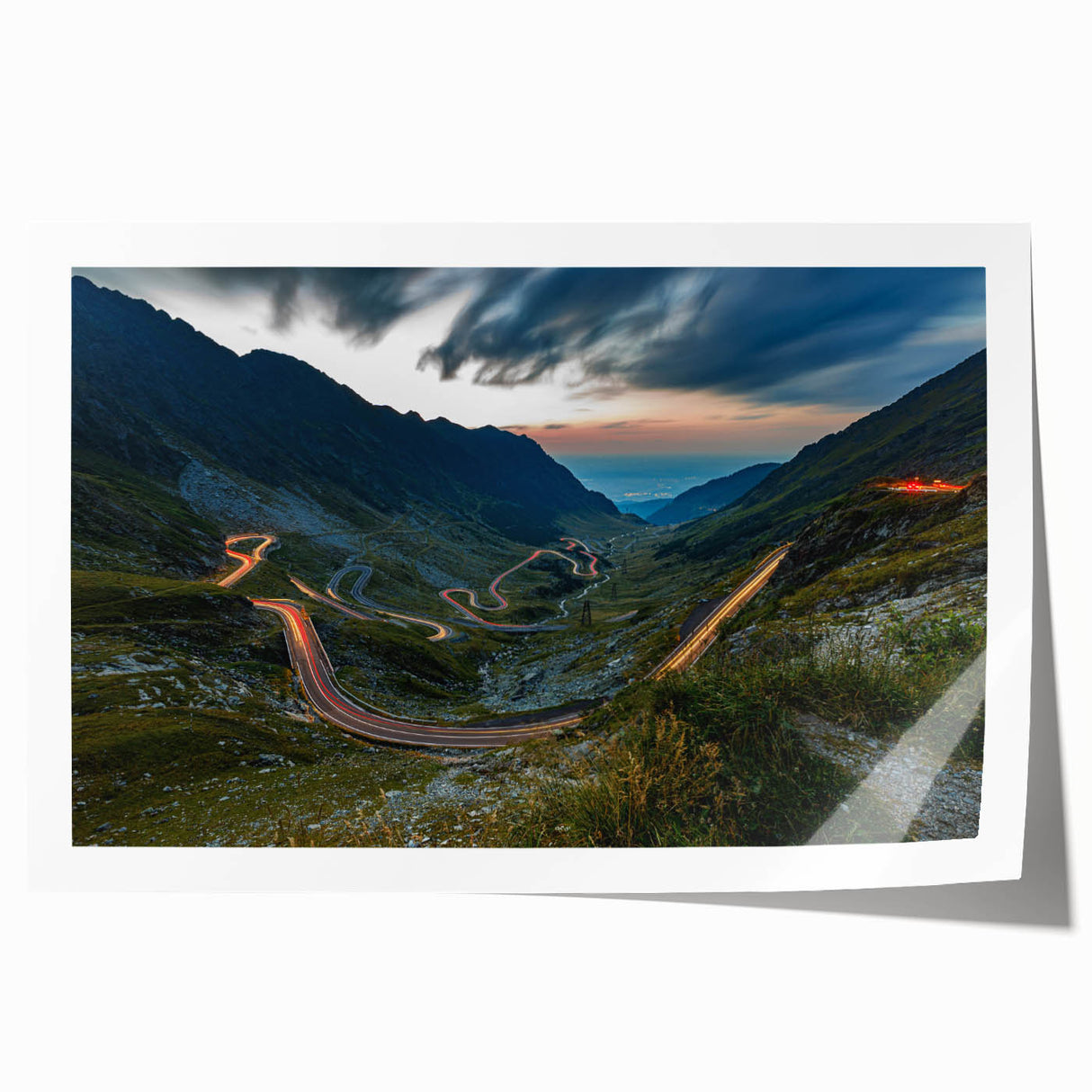 Rolled print of a Romanian landscape featuring vibrant green fields and blue skies, ideal for dining room decor.