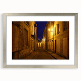 Textured abstract art print depicting Stockholm scenery in muted earth tones on a framed silver mat.