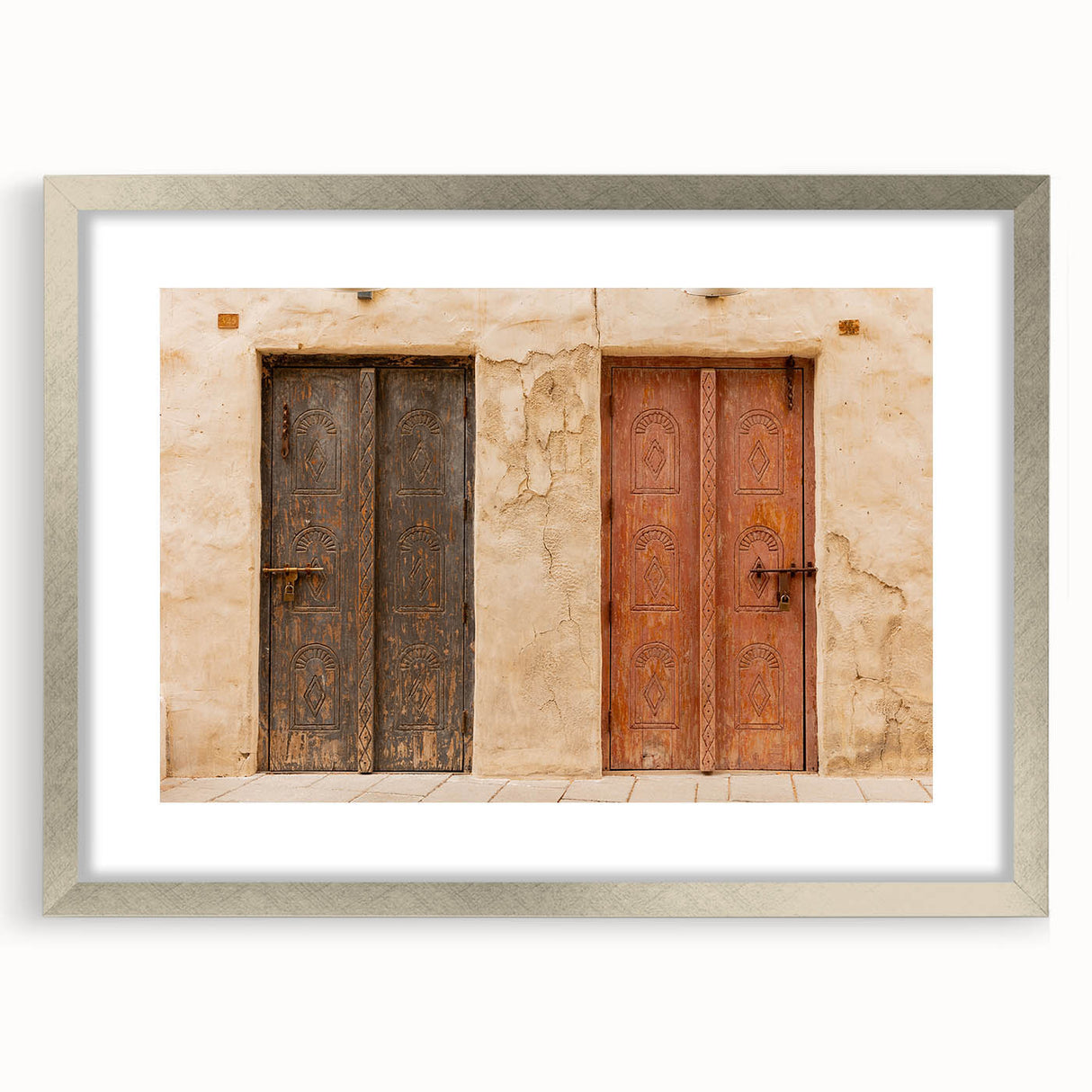 Textured abstract art print of Dubai skyline in silver frame, featuring muted earth tones, ideal for bedroom art.