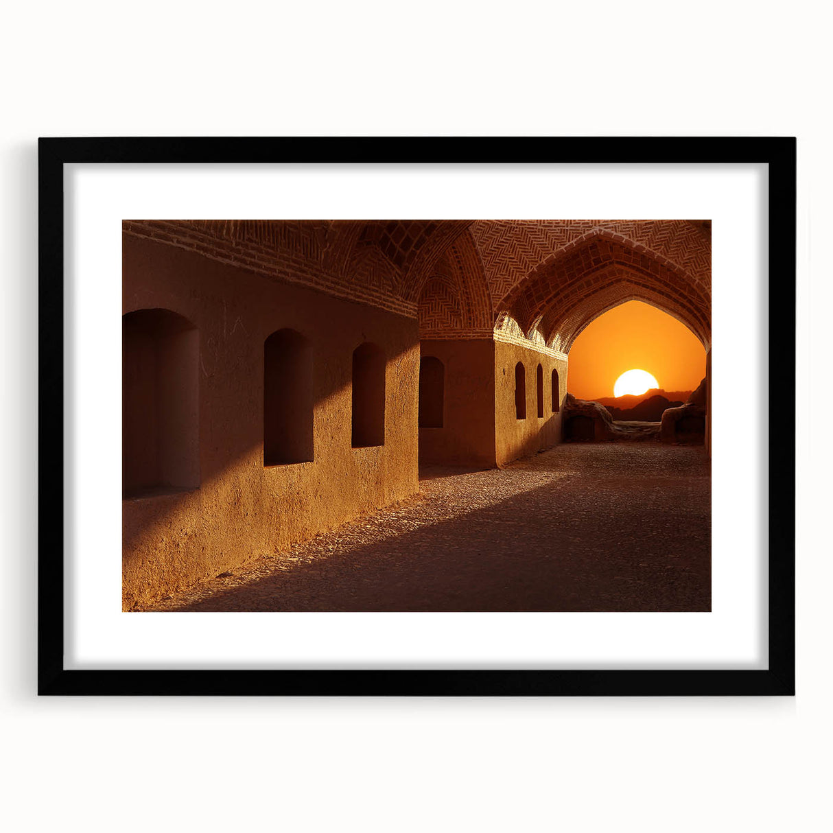 Colorful abstract art print of a Middle Eastern scenery on a textured canvas, framed in black.