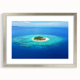 Textured abstract art print depicting an oceanic scene in cool blue and green tones, framed in silver, ideal for bedroom art.