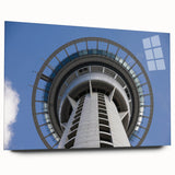 Large abstract wall art of Auckland skyline in muted blue and gray tones on acrylic glass.