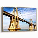 Framed canvas featuring a vintage-style landscape painting of a Venezuelan scenery in muted gold and black tones.