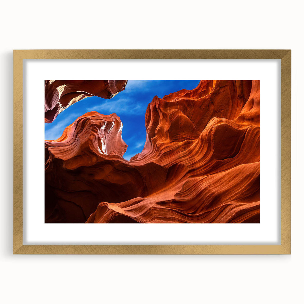 Extra large abstract art print of Antelope Canyon in Arizona, displaying textured orange and red hues on a framed canvas.