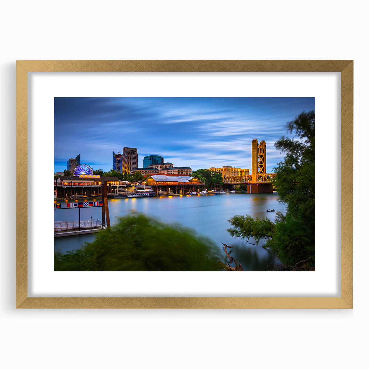 Extra large abstract art print featuring textured scenery of Sacramento in muted earth tones, framed in gold.