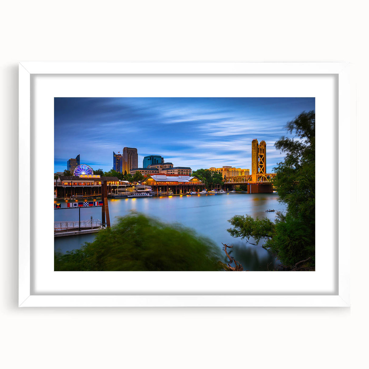 Abstract art print of Sacramento scenery in muted earth tones on a framed white mat, suitable for dining room decor.