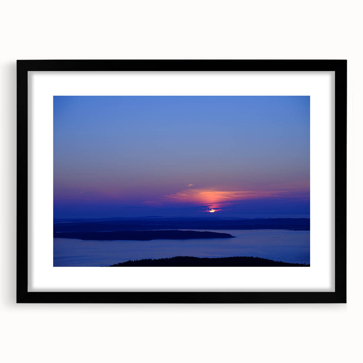 Colorful abstract art print of Acadia, Maine scenery in a black frame with mat.