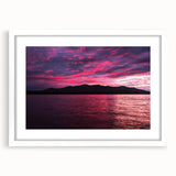Abstract art print of Maine's scenery in muted blue and green tones on a white framed canvas, suitable for dining room decor.
