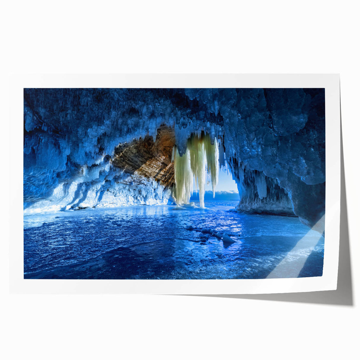 Scenic Michigan Upper Peninsula landscape on rolled print, featuring lush greenery and a calm lake.