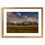 Extra large abstract art print depicting a textured Montana scenery in muted earth tones, framed in gold.