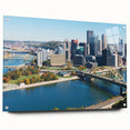 Acrylic print of Pittsburgh skyline in muted gray and blue tones, suitable for bedroom or dining room decor.