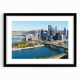 Extra large framed abstract print of Pittsburgh skyline in vibrant, colorful hues, ideal for living room decor.