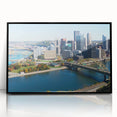 Large abstract wall art of Pittsburgh skyline in muted gray and blue tones on framed acrylic, ideal for modern office decor.