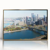 Framed acrylic print of Pittsburgh skyline in gold tones, ideal for modern art wall decor.