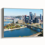 Framed canvas of a vintage-style Pittsburgh landscape in silver, black, and colorful tones, ideal for office decor.