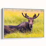Vintage poster art of the Grand Tetons in muted earth tones on a framed canvas, suitable for living room decor.