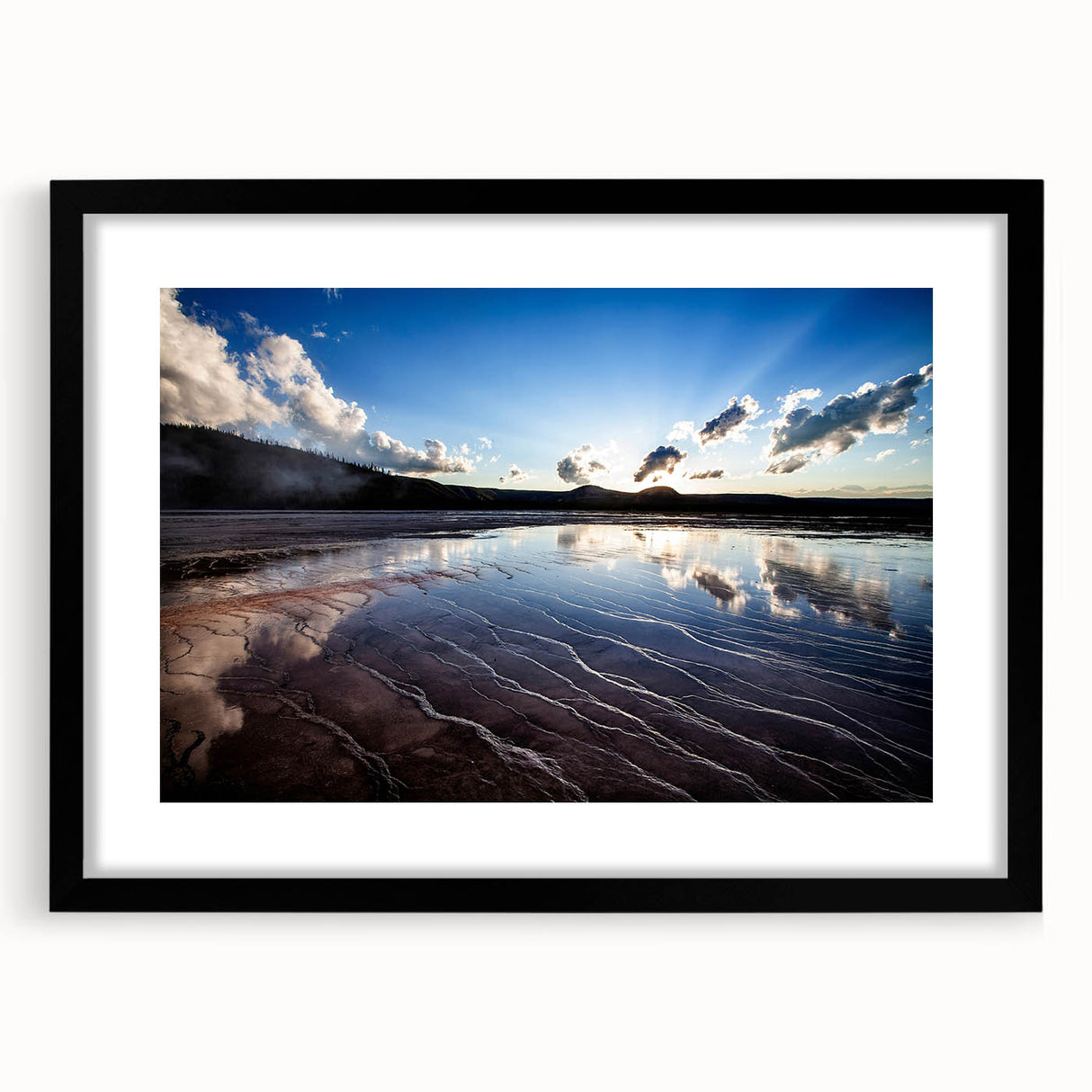 Abstract art print of Yellowstone with textured colors in blue, green, and orange, framed in black.