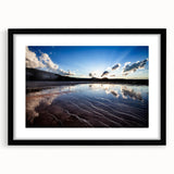 Abstract art print of Yellowstone with textured colors in blue, green, and orange, framed in black.