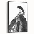 Framed abstract figurative canvas artwork showcasing dynamic shapes and bold colors, displayed from a side view against a neutral background. Ideal for modern decor.