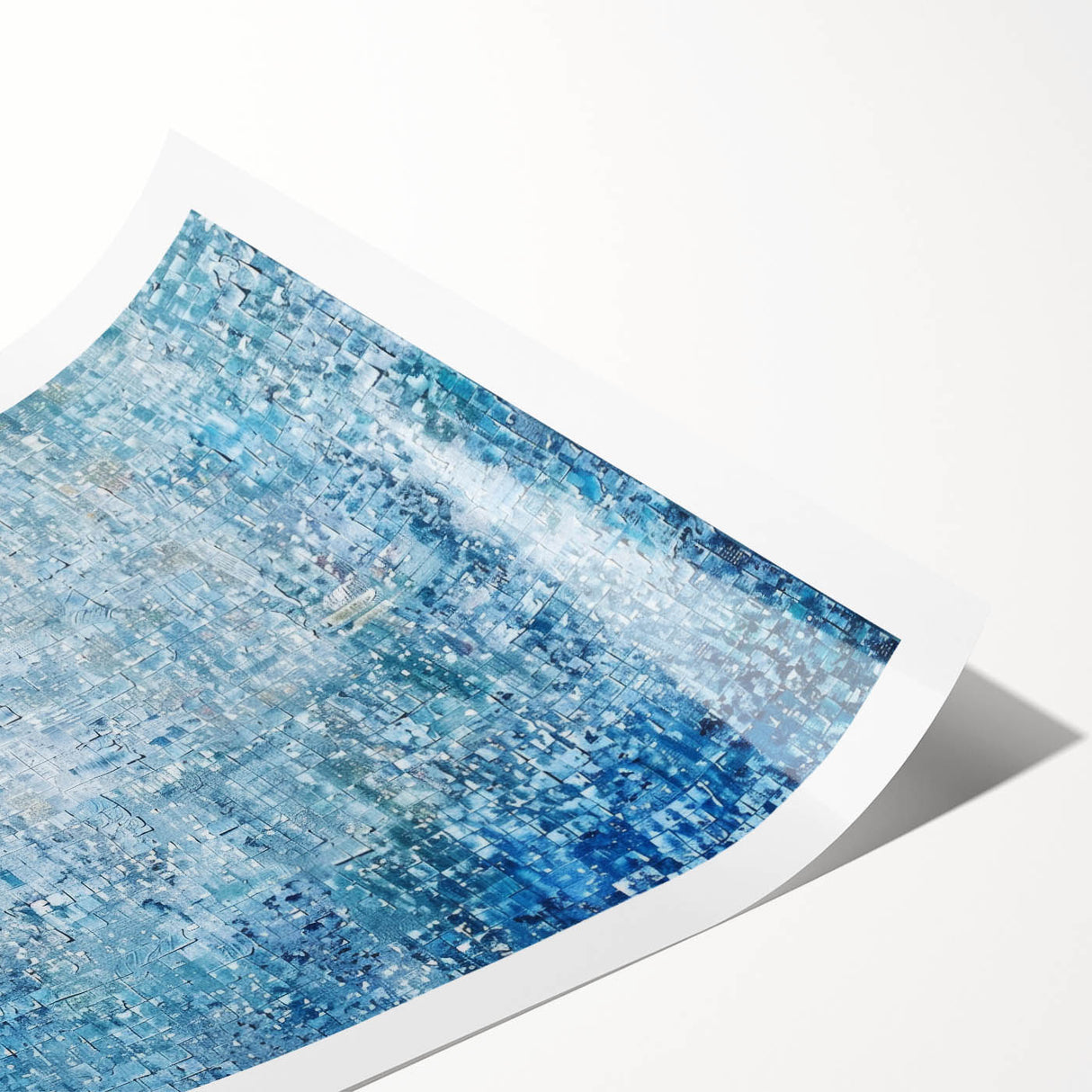 Abstract art print featuring vibrant splatters in shades of blue, orange, and yellow, rolled and ready for display. Perfect for modern home decor or art enthusiasts.