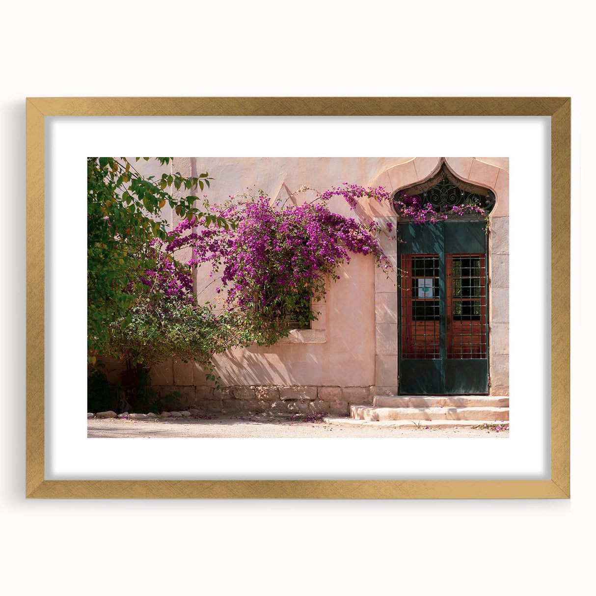 Textured abstract art print of an Algerian landscape in muted earth tones, framed in gold, ideal for bedroom art.