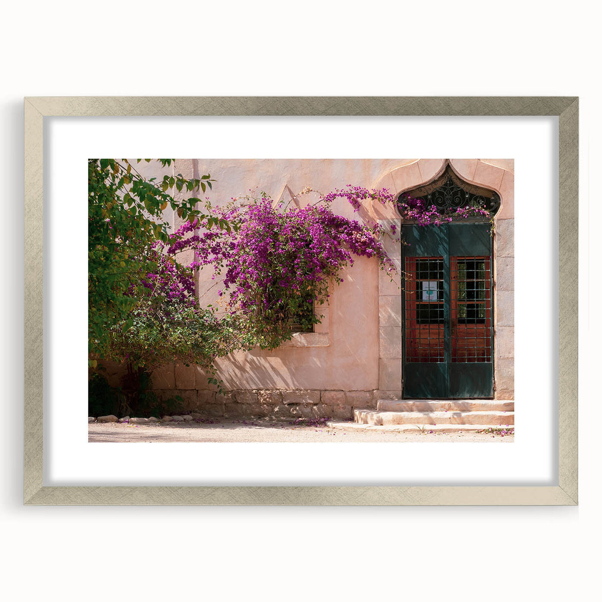 Abstract art print featuring a silver-framed depiction of Algerian scenery, ideal for dining room decor.