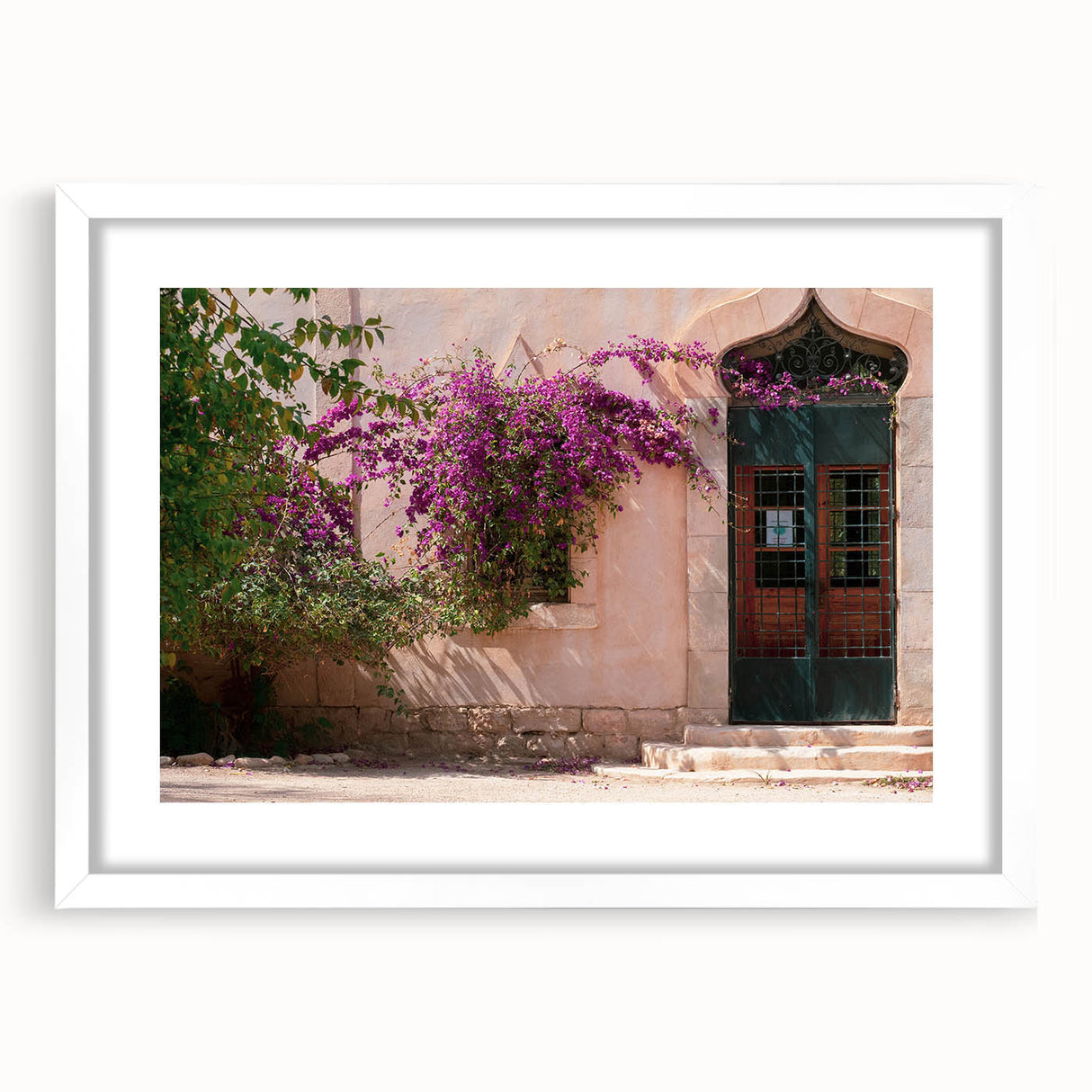 Extra large abstract art print depicting a textured scenery of Algeria, in muted earth tones, framed with a white mat.