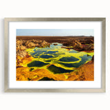 Abstract art print of an Ethiopian landscape in muted earth tones on a framed silver mat.