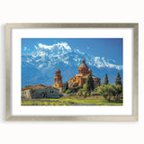 Textured abstract art print featuring muted earth tones, framed in silver, ideal for bedroom ambiance.