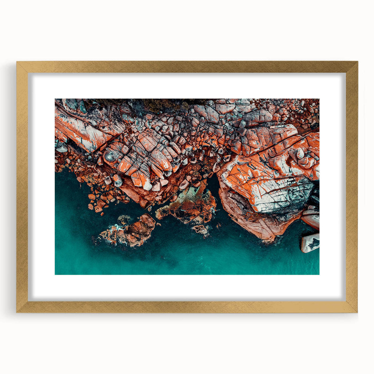 Abstract art print of a Tasmanian landscape in muted earth tones, framed in gold, suitable for dining or bedroom decor.