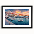 Abstract art print of a colorful European scenery in vibrant hues on a large textured canvas, framed in black.