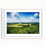 Textured art print of an abstract European scenery in muted earth tones on a framed white mat, ideal for bedroom art.