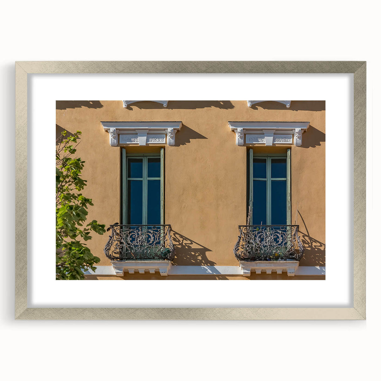 Extra large abstract art print of a textured European scenery in muted earth tones, framed in silver.