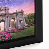 Close-up of a framed canvas featuring a textured, colorful depiction of Madrid’s skyline on a black background.
