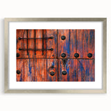 Textured abstract art print of Baja California scenery in muted earth tones, framed in silver, ideal for bedroom ambiance.