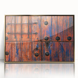 Large art print of Baja California scenery in gold frame, featuring mid-century modernist style.