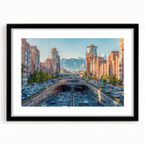 Extra large abstract art print featuring a colorful, textured depiction of a Middle Eastern scenery, framed in black.