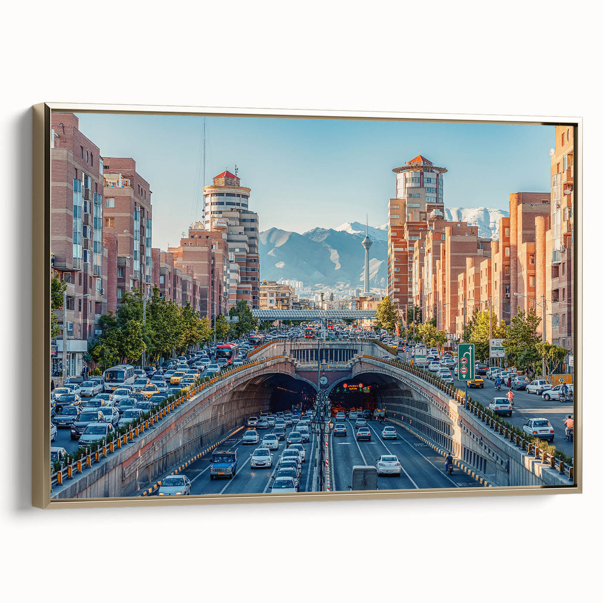 Framed canvas depicting a vintage-style landscape painting of a Middle Eastern scene in gold and black tones.
