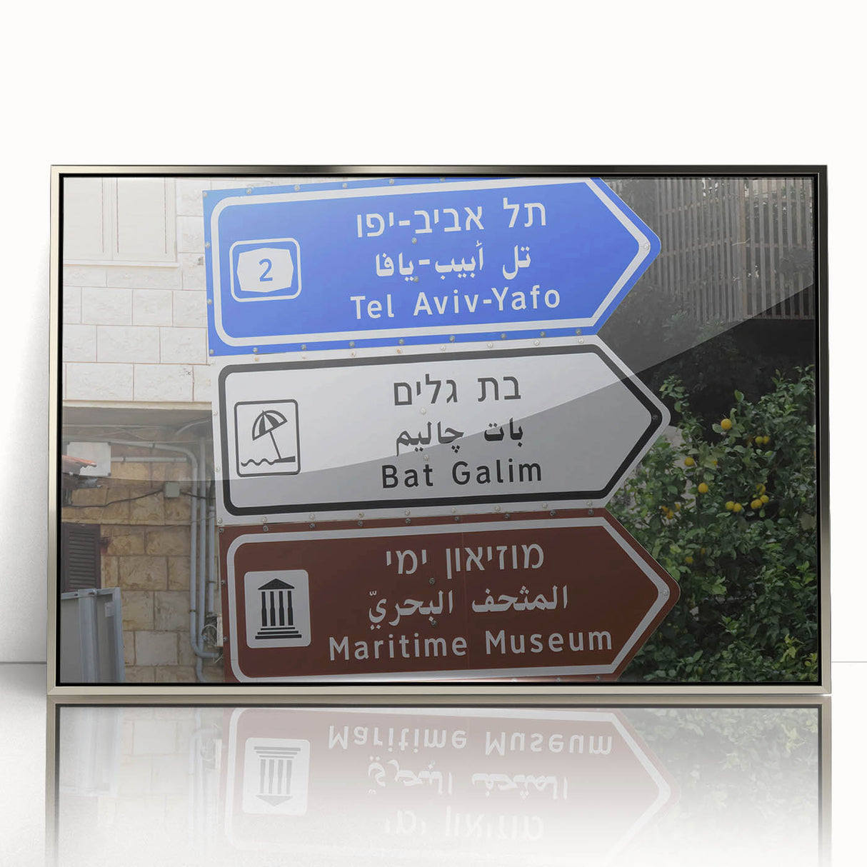 Mid-century modernist art depicting the Tel Aviv skyline in muted blue and silver tones, acrylic print framed in silver.