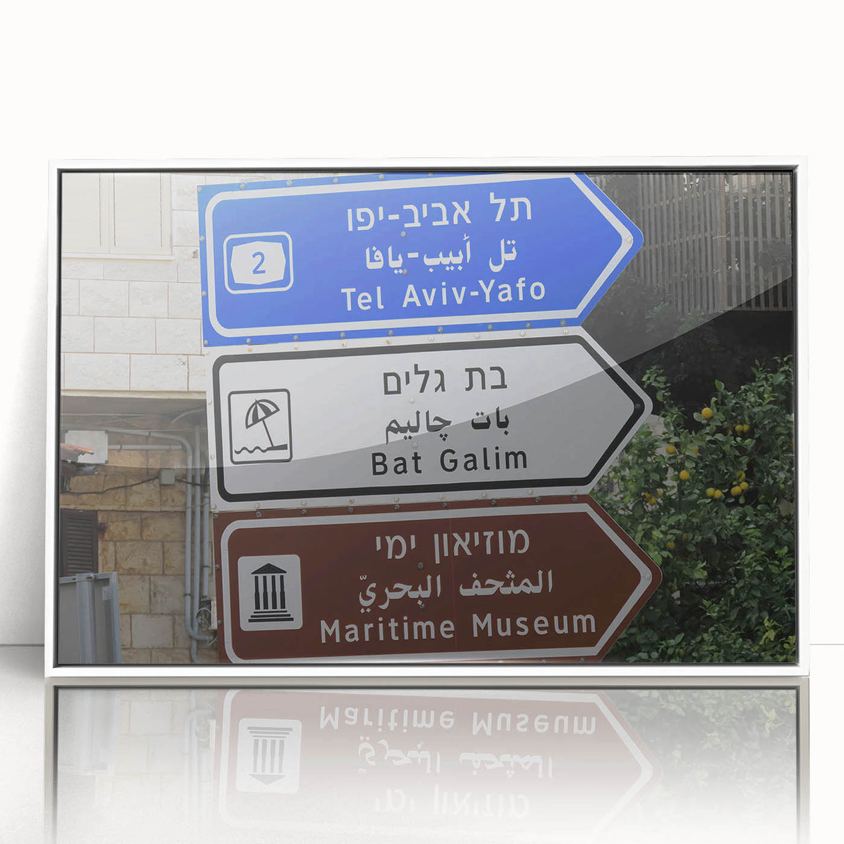 Art deco poster of Tel Aviv skyline in muted gray and blue tones, acrylic print framed in white.