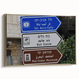 Framed canvas of Tel Aviv landscape in muted gold and black tones, ideal for bedroom wall art.