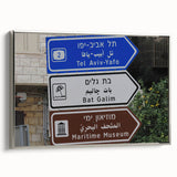 Landscape art painting of Tel Aviv featuring colorful, vintage-style poster art on black framed canvas.